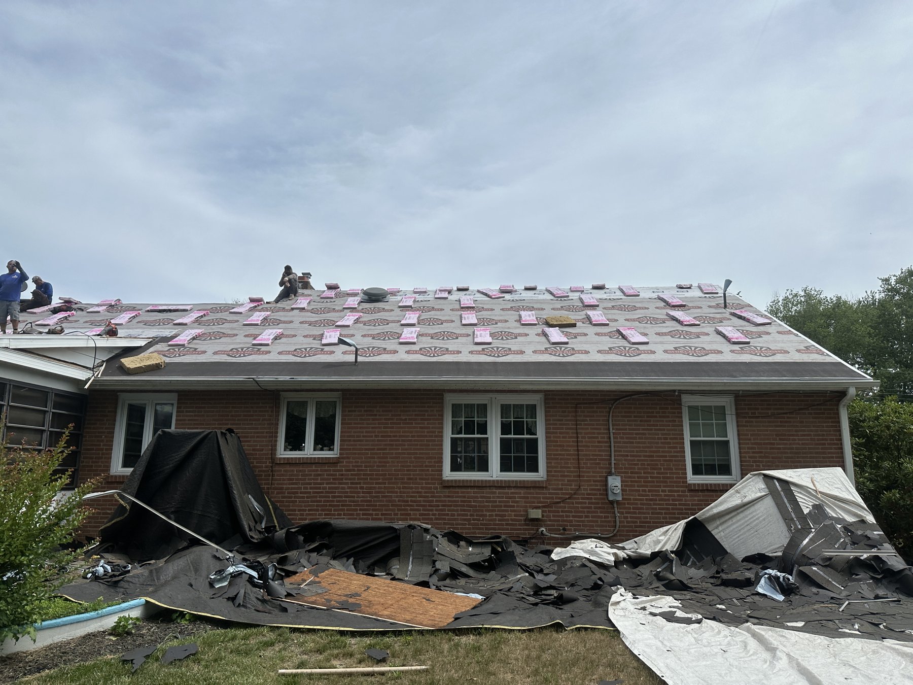 Synthetic underlayment and shingle bundles loaded on roof in Mickleton NJ
