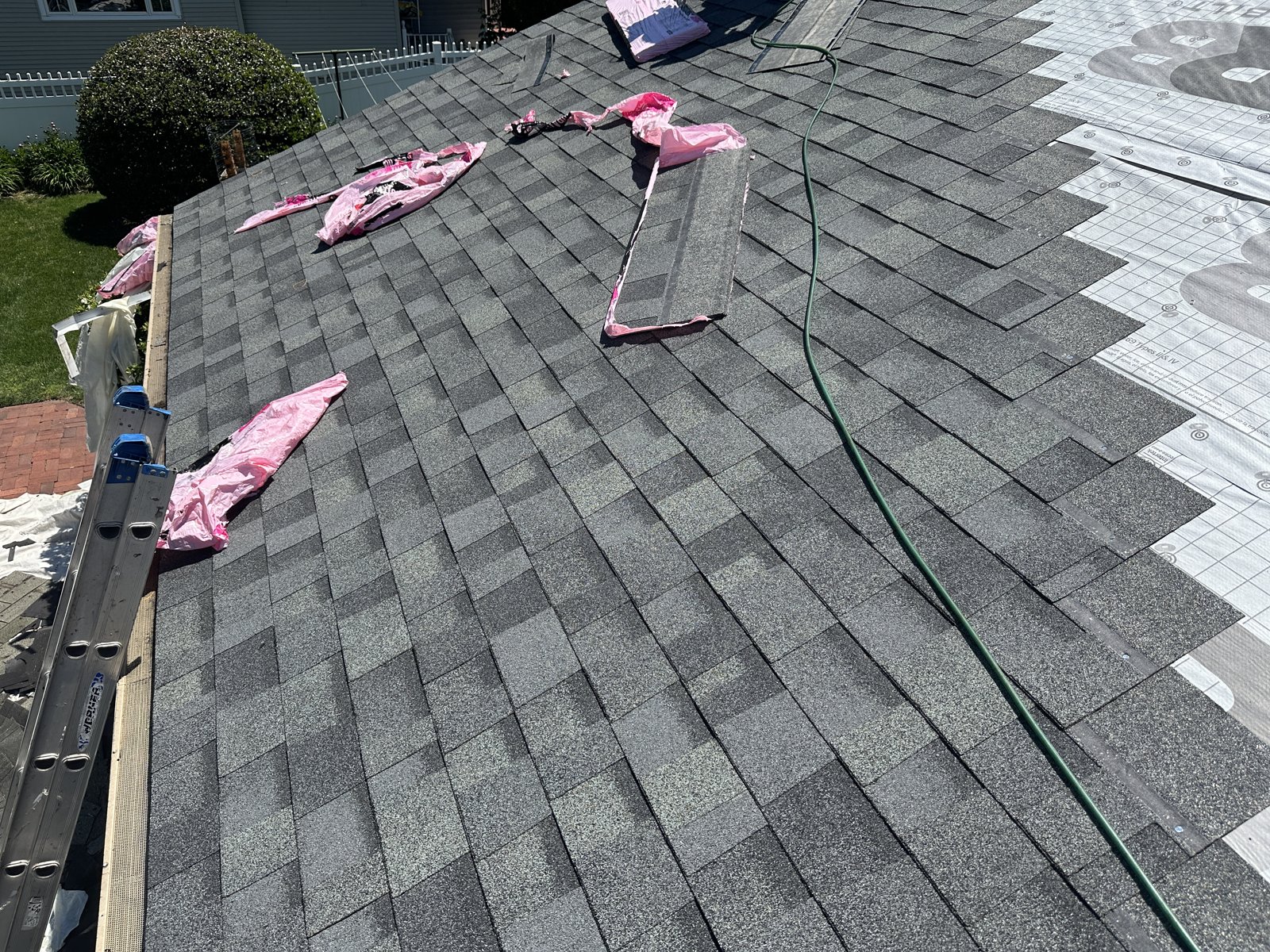 Owens Corning Duration Estate Gray shingles being installed over Deck Defense underlayment