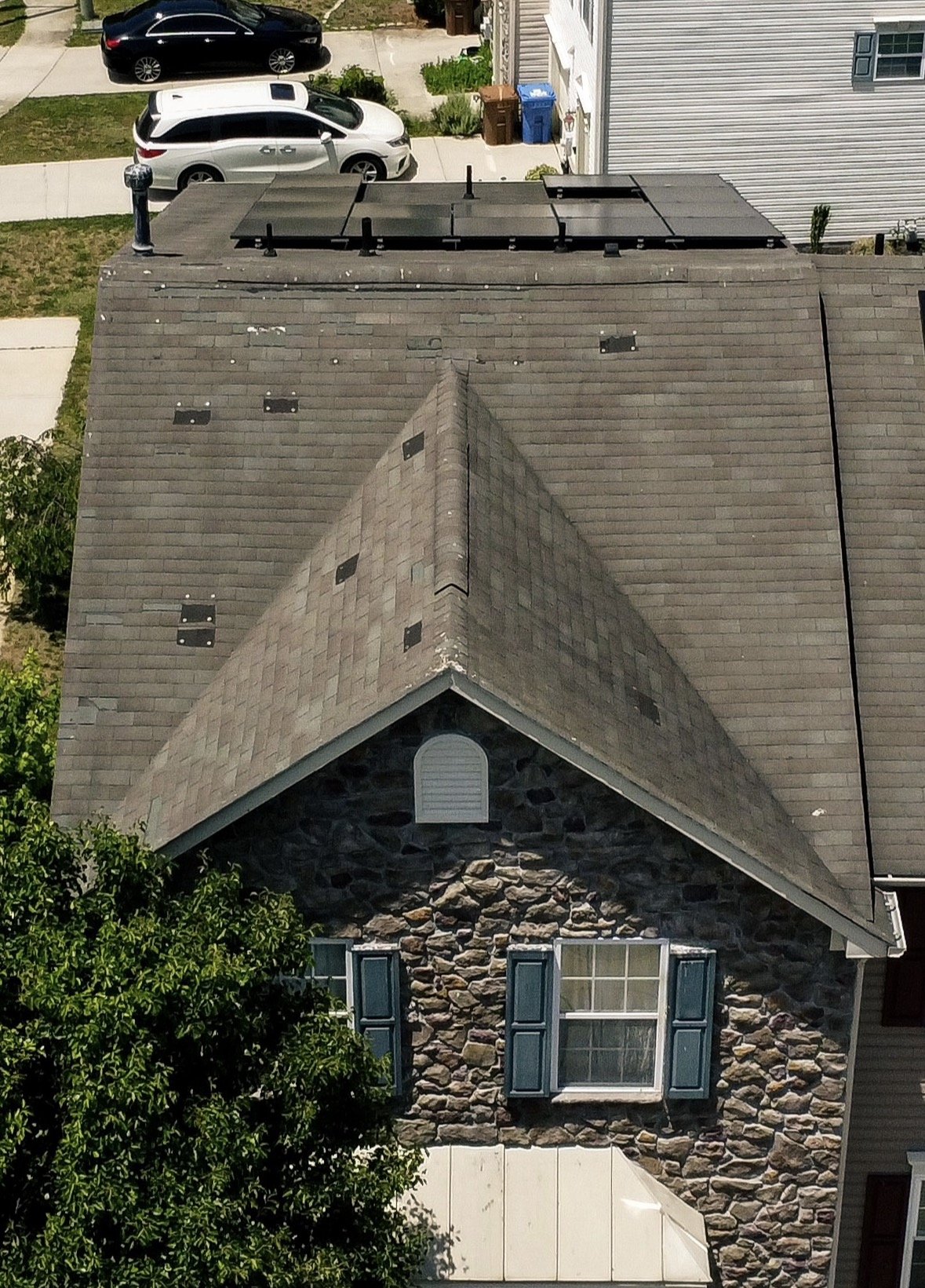 Storm damaged patched roof in Woolwich Township NJ before replacement